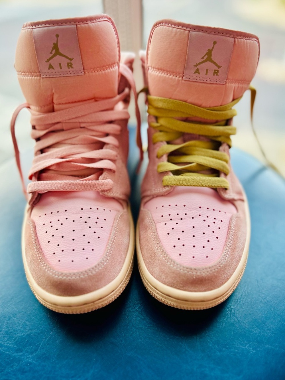 Jordan 1 Mid "Coral Gold"
 Pink High-Top Sneakers with Pink & Gold Accent Laces